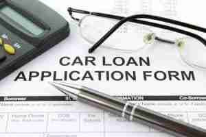 Car loan application form and pen