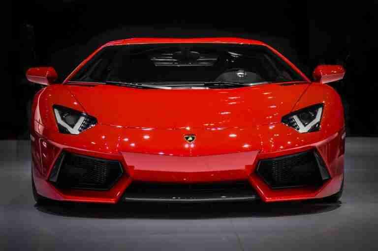Sleek red lamborghini sports car on display. car finance for people with bad credit