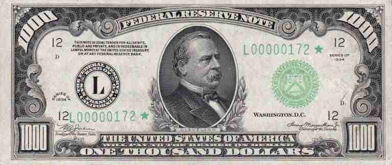 A black and white image of a united states one thousand dollar federal reserve note from the series of 1934, with a portrait of grover cleveland in the center.
