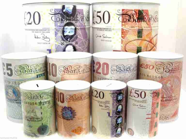 A collection of british pound sterling banknotes rolled up and arranged by denomination.