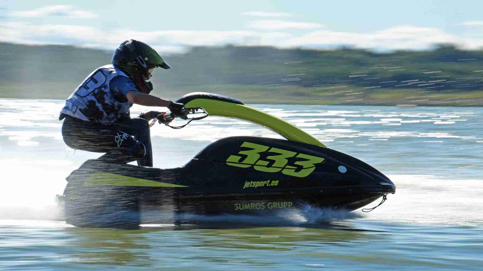 High-speed jet ski racing across the water, leaving a trail of spray in its wake. secured loans fast.