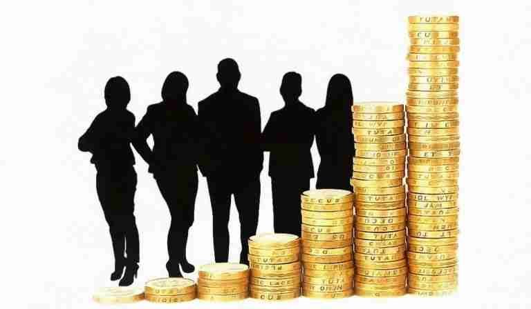 installment loans no credit check direct lenders piles of coins with shadow people behind