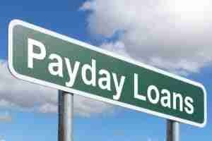 payday loans road sign