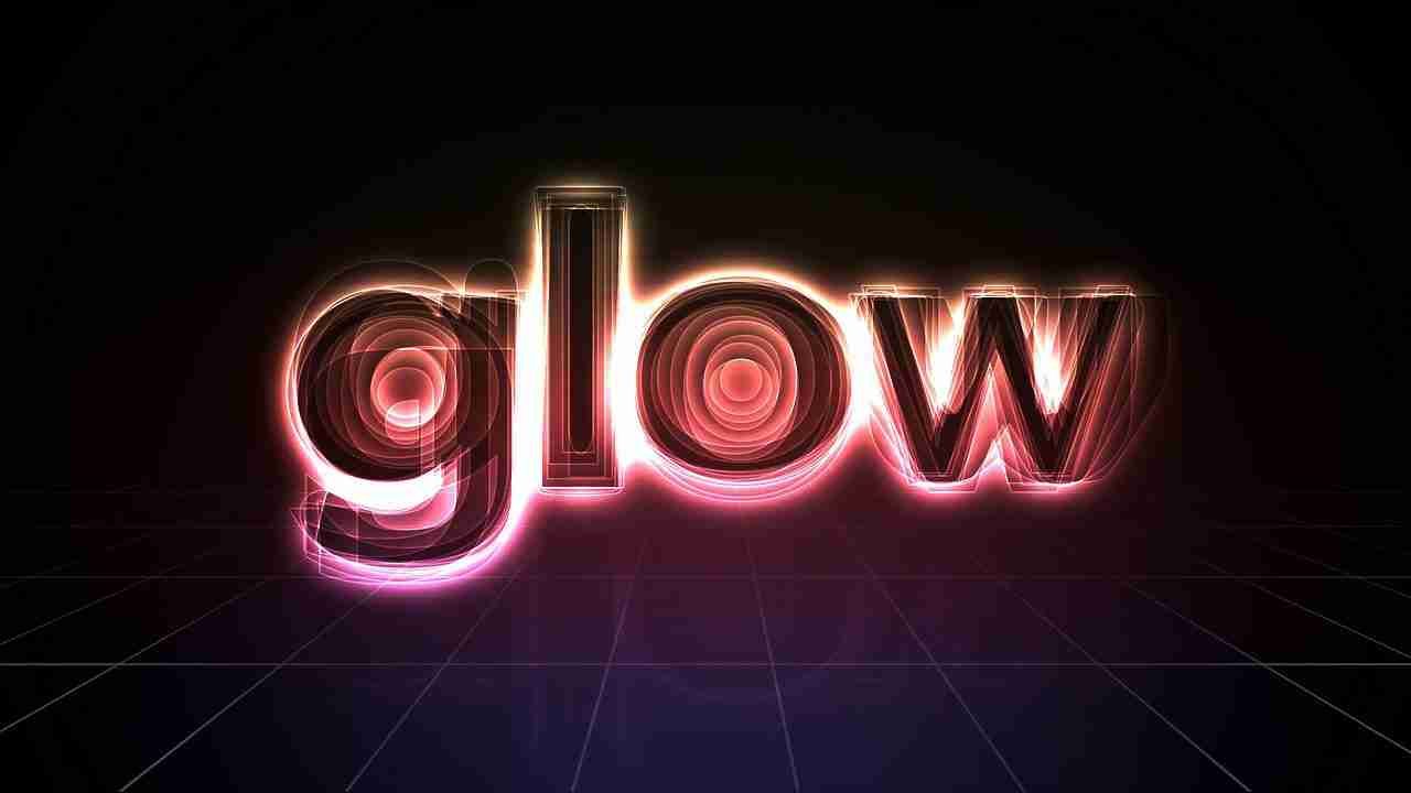 Glo Guarantor Loans Guaranteed Approval Online 3D rendering of the word "glow" with a neon light effect on a dark grid-lined background.
