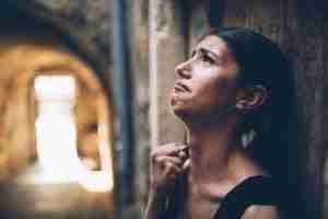 woman crying in the street desperate