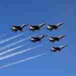 Quick Loans Same Day A formation of six fighter jets flying in the sky, leaving behind parallel contrails. Fast Loans