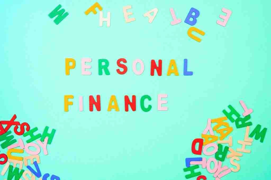 covid 19 affecting personal finance coloured letters on board