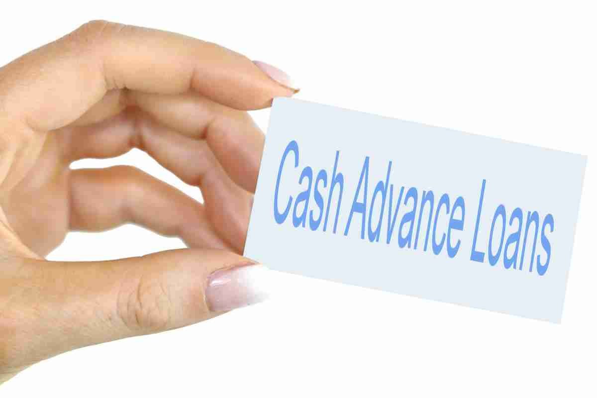 Small Cash Loans Bad Credit A person's hand holding a business card with the text "Cash Advance Loans" printed on it. small cash loans.