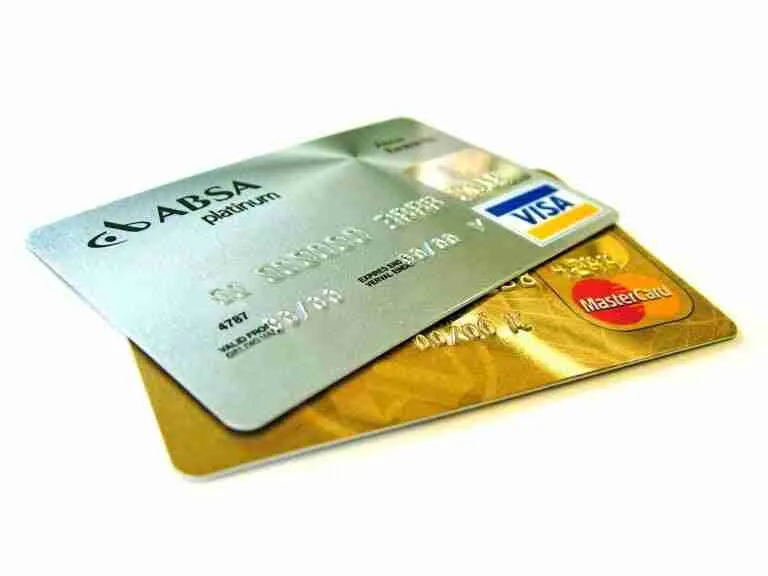 A stack of three credit cards including Visa and MasterCard on a light background. 2500 credit card