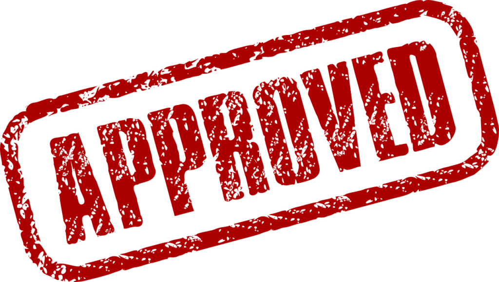 Red "APPROVED" stamp impression on a green background. Approved Loans