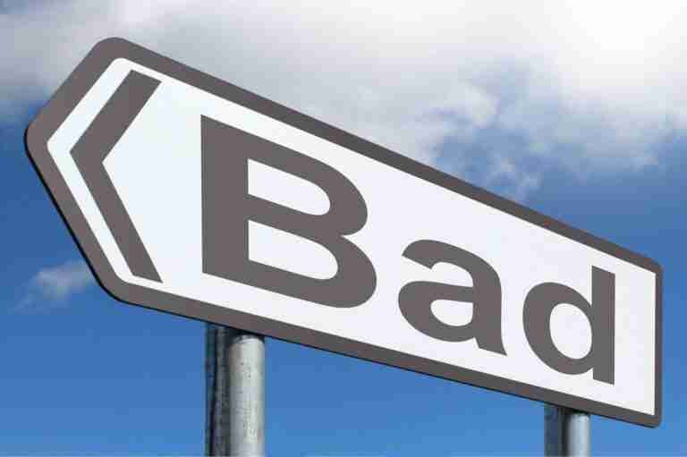 A road sign with the word "Bad" and a left-pointing arrow against a blue sky with clouds. bad credit direct lender