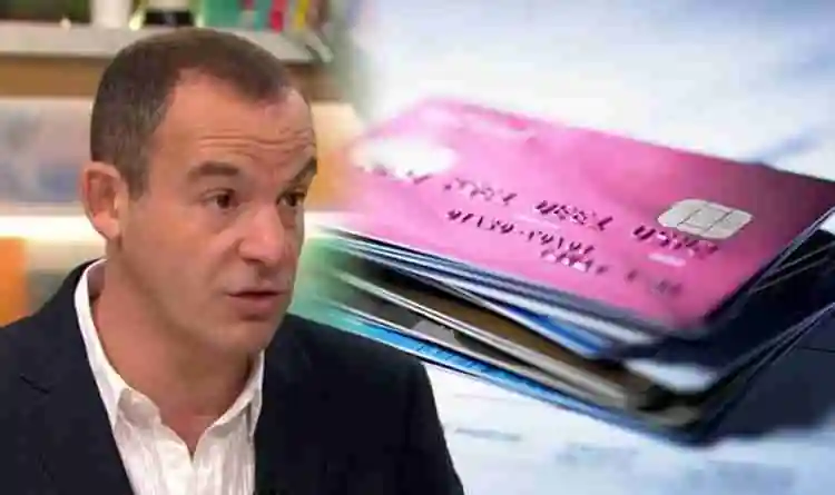 Martin Lewis in a suit is in the foreground with a blurred stack of credit cards and a wallet visible in the background. martin lewis credit cards