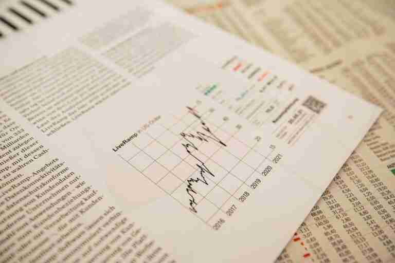 newspaper showing graph - Understanding County Court Judgments (CCJs) and Loan Eligibility