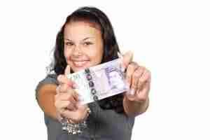 Small Cash Loans smiling girl holding cash in hands