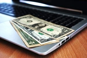 cash on laptop