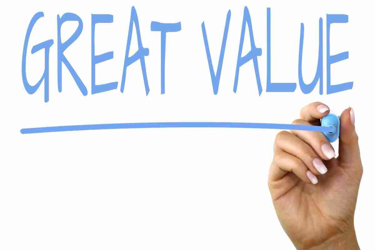 A hand using a marker to write 'best loan rates' above a drawn underline, symbolizing the emphasis on excellent worth or benefits for the price.