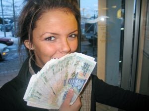 girl smiling with cash in hand
