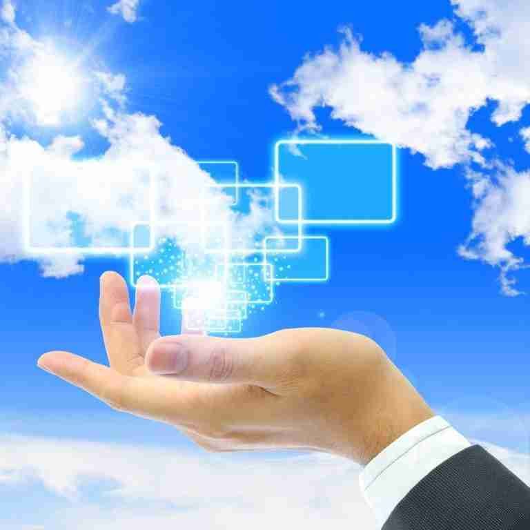 Conceptual image of a hand reaching towards a symbolic cloud computing diagram in the sky, representing virtual technology, connectivity, innovation, and short loans in the digital age.